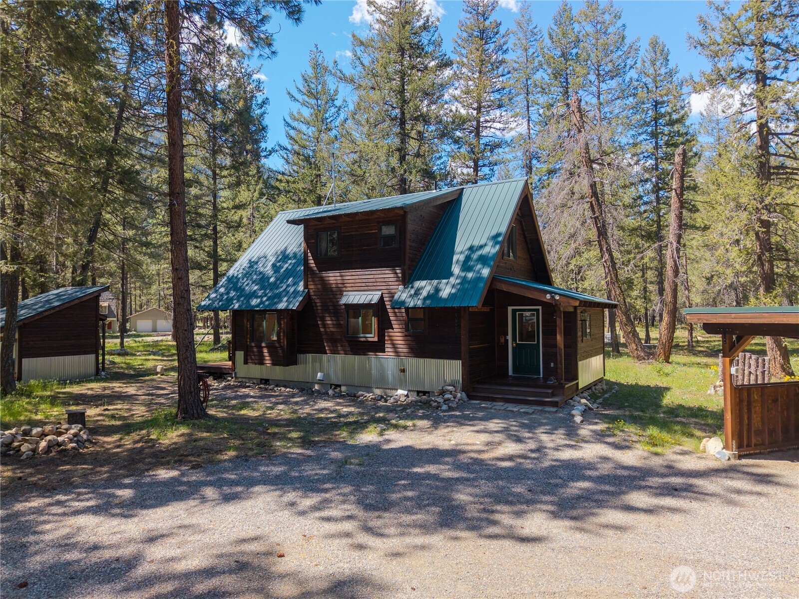 651 Lost River Road Mazama, WA 98833 - Photo 37 of 38 a front view of a house with a yard