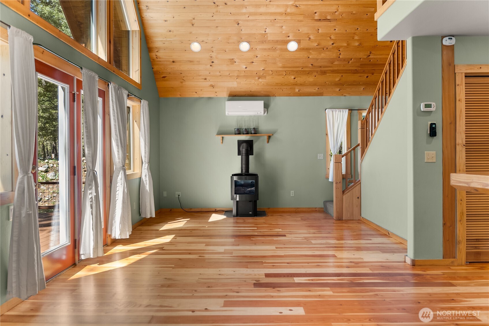 651 Lost River Road Mazama, WA 98833 - Photo 6 of 38 a view of a livingroom with wooden floor and stairs