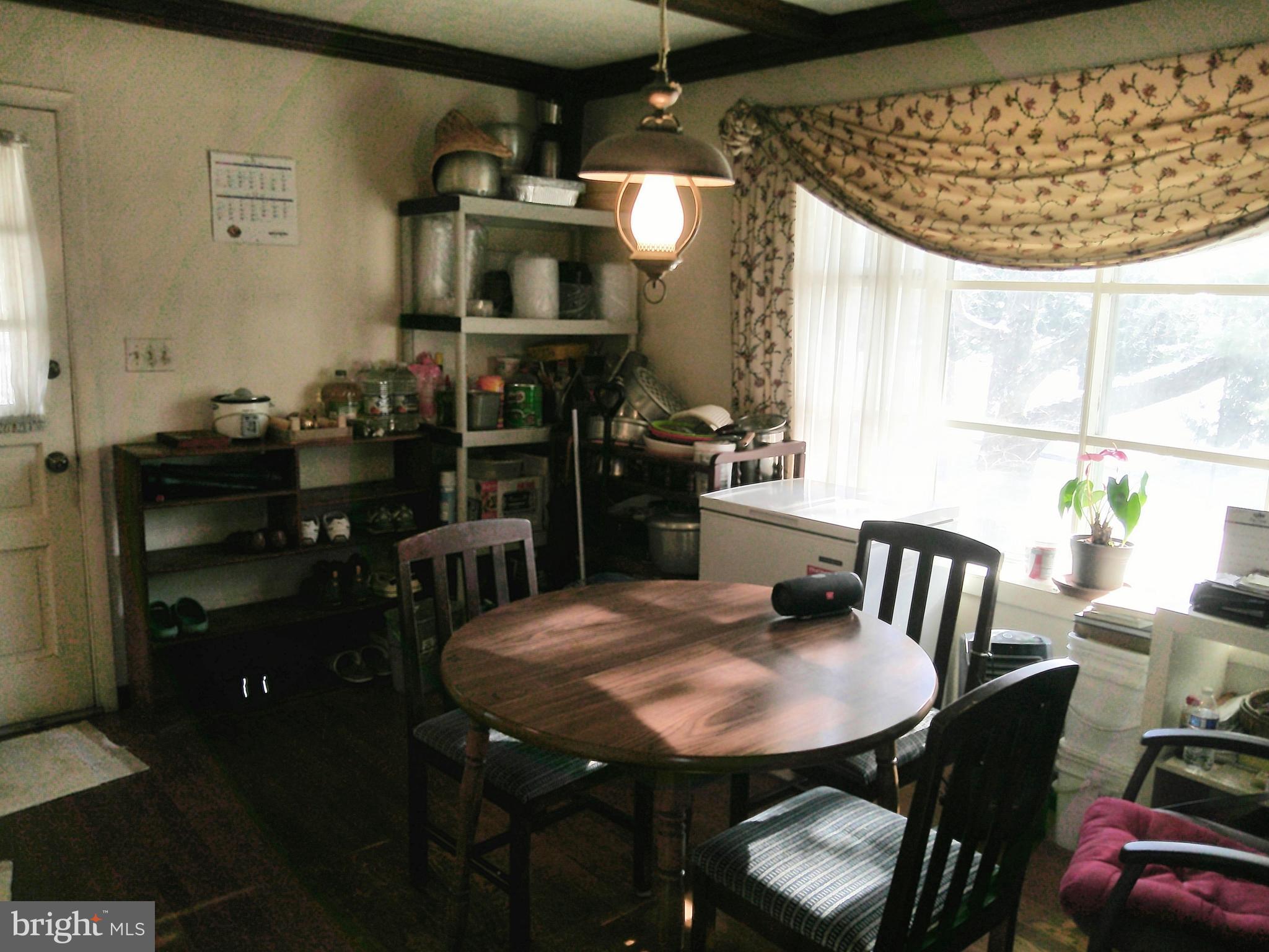 12300 Downer Drive Silver Spring, MD 20906 - Photo 27 of 53 a view of a dining room with furniture