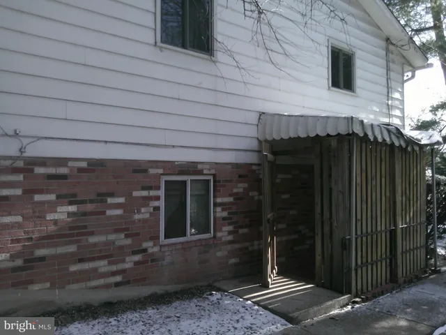 a view of staircase with a glass door