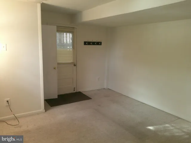 a kitchen with stainless steel appliances a stove a sink and white cabinets