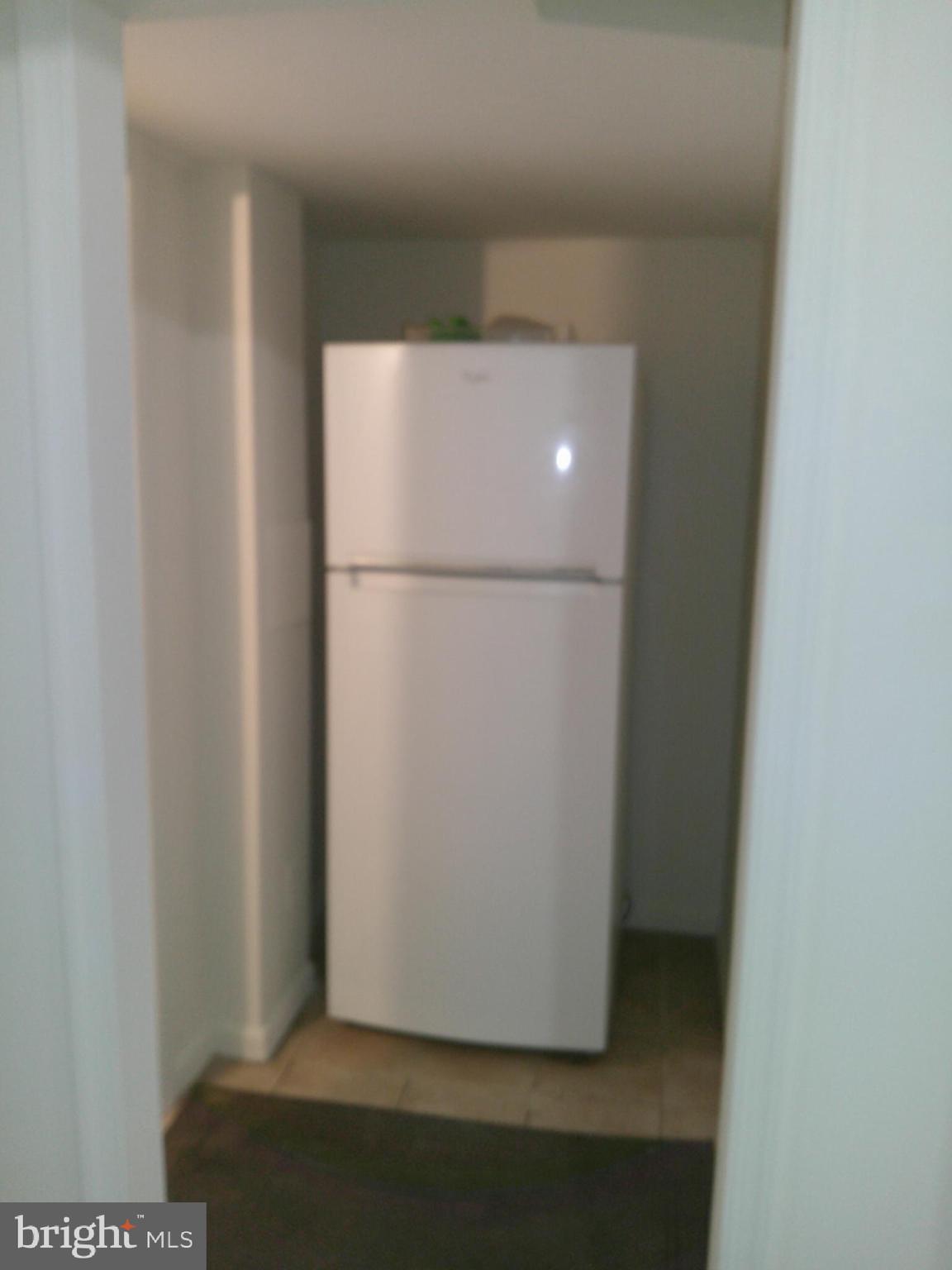 12300 Downer Drive Silver Spring, MD 20906 - Photo 49 of 53 a view of a refrigerator in a kitchen