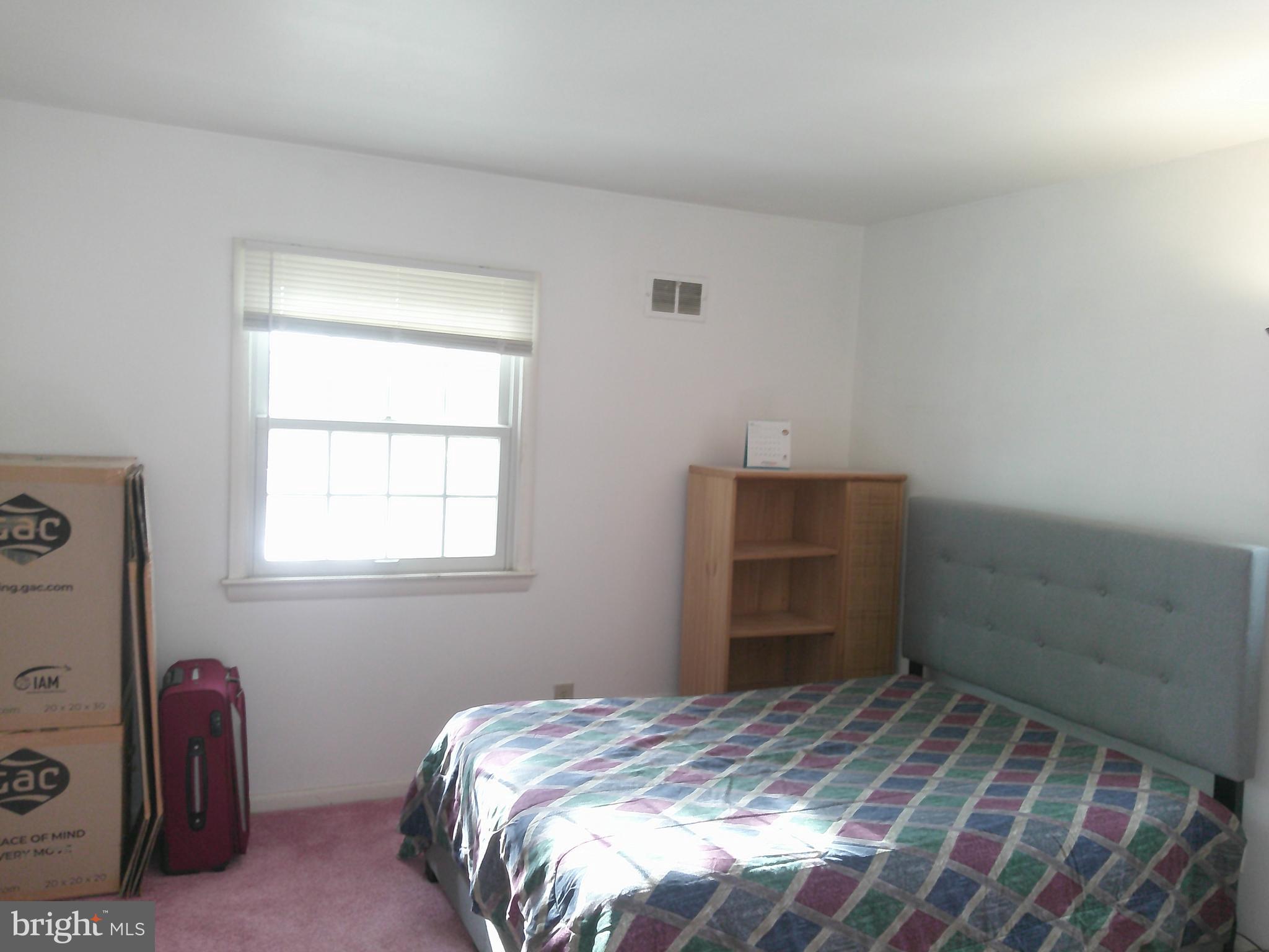 12300 Downer Drive Silver Spring, MD 20906 - Photo 9 of 53 a bedroom with a bed and a window
