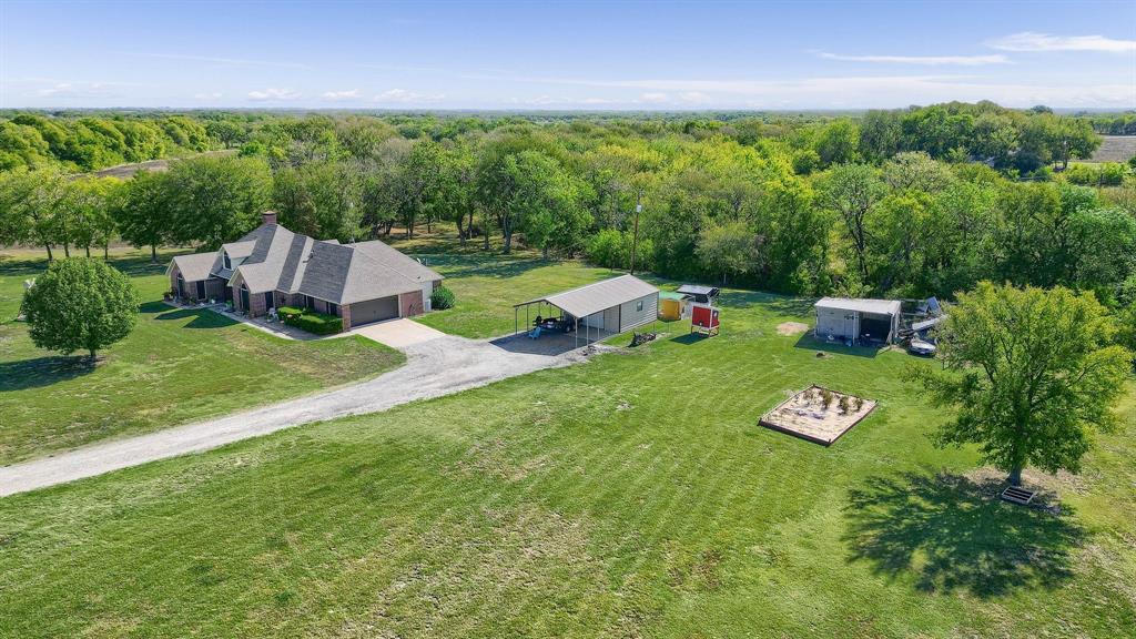 688 Harris Road Howe, TX 75459 - Photo 10 of 12 a view of a golf course with a garden
