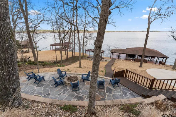 a view of a chairs and table in the patio