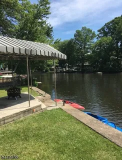 a view of a lake with a wooden deck