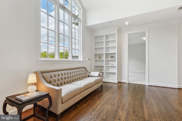 a view of a bedroom with furniture and window