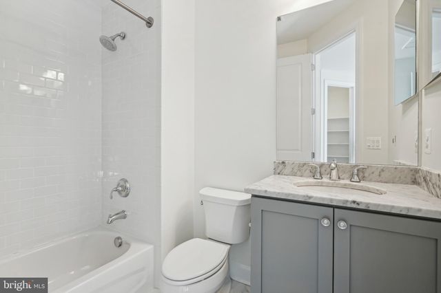 a view of an empty room with a large window