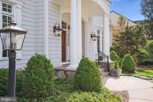 a view of a house with a yard and plants