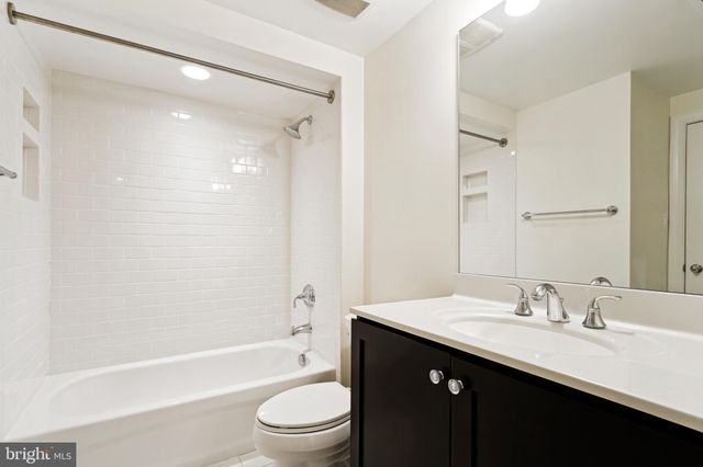 a view of kitchen with furniture and flat screen tv