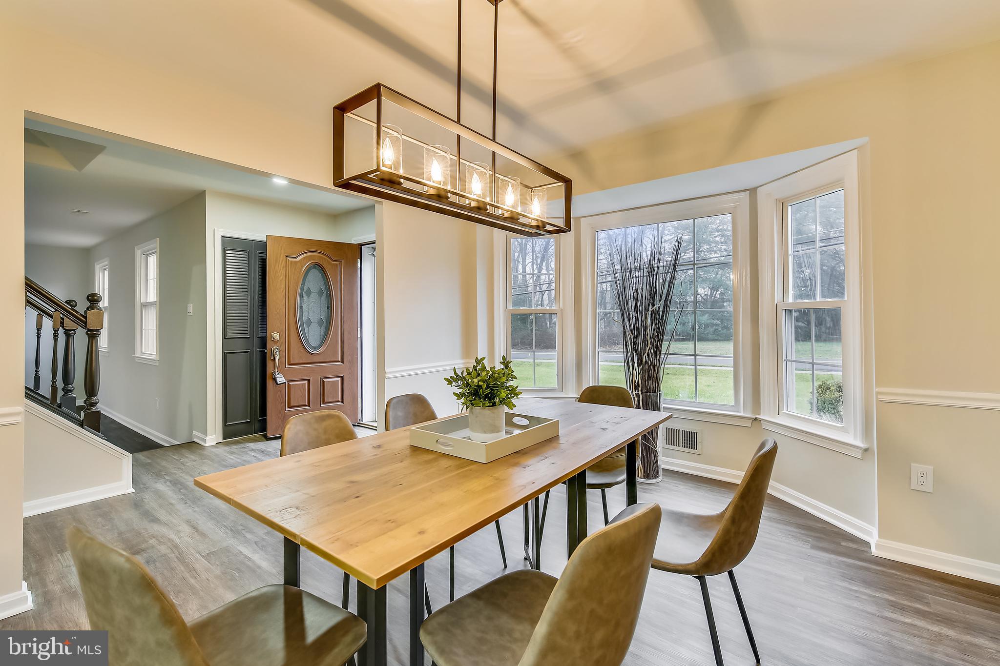 4238 Briars Road Olney, MD 20832 - Photo 6 of 44 a view of a dining room with furniture window and wooden floor