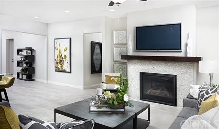 32511 Parker Street Menifee, CA 92584 - Photo 4 of 6 a living room with furniture a flat screen tv and a fireplace