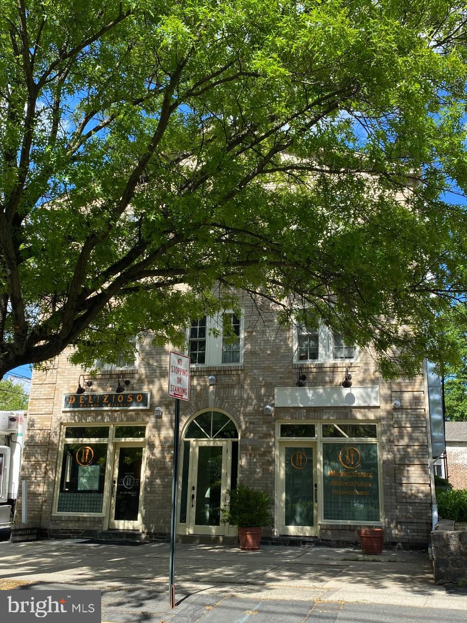 a front view of a building with street view