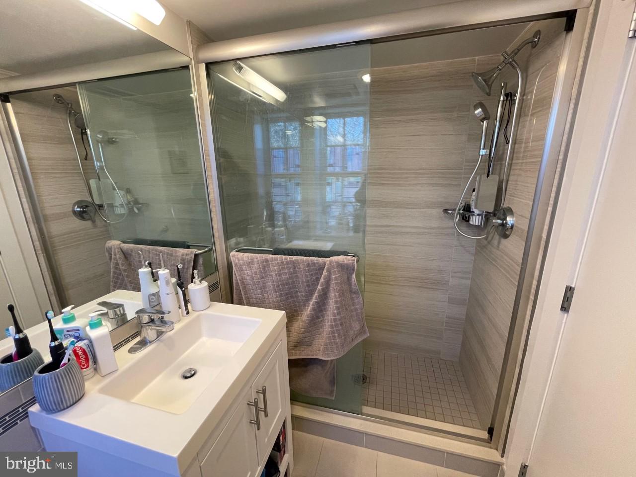 205 Witherspoon Street, Unit 4 Princeton, NJ 08542 - Photo 11 of 11 a bathroom with a sink mirror and shower