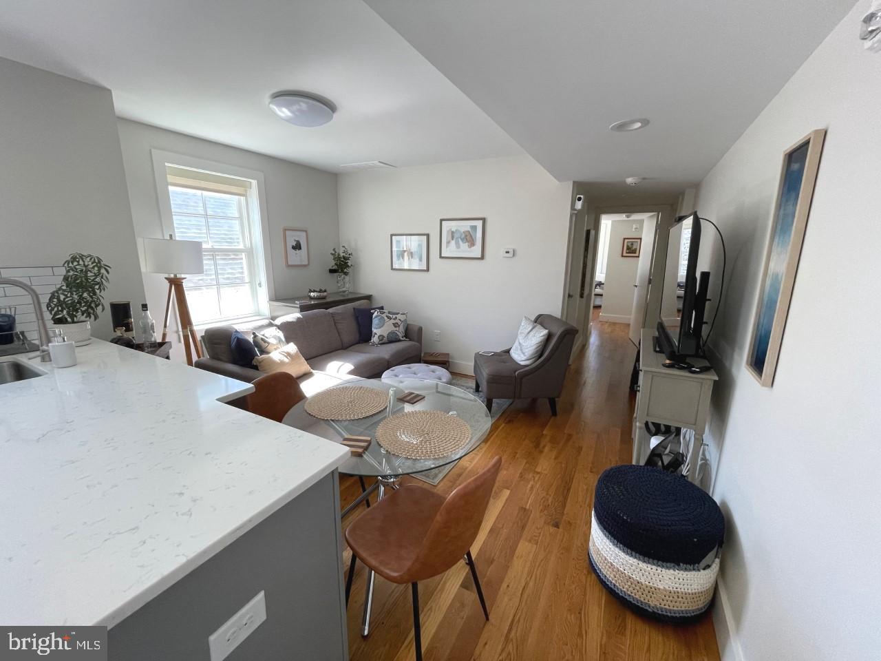 205 Witherspoon Street, Unit 4 Princeton, NJ 08542 - Photo 2 of 11 a living room with furniture a window and gym equipment