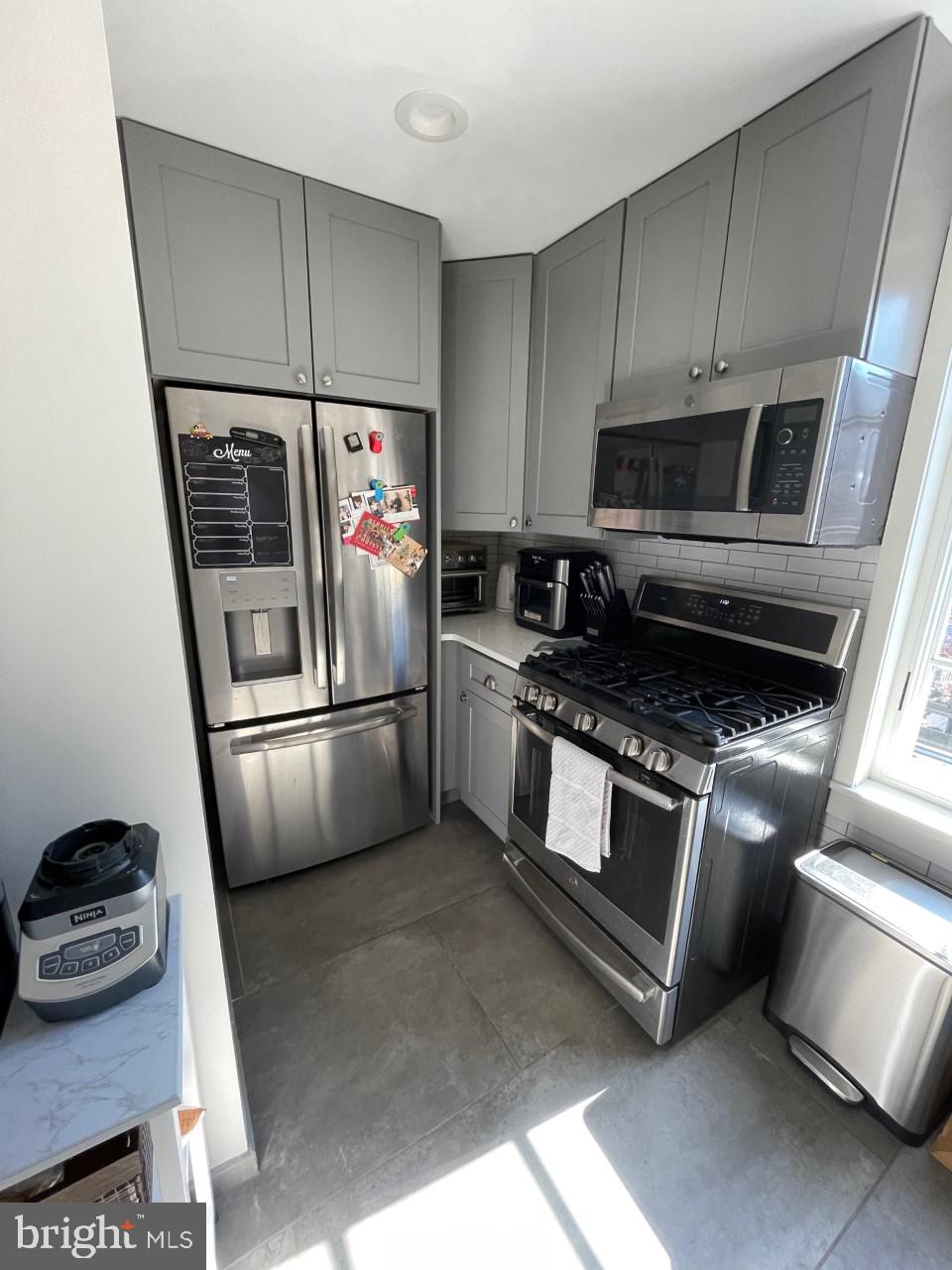 205 Witherspoon Street, Unit 4 Princeton, NJ 08542 - Photo 4 of 11 a kitchen with a refrigerator stove and microwave