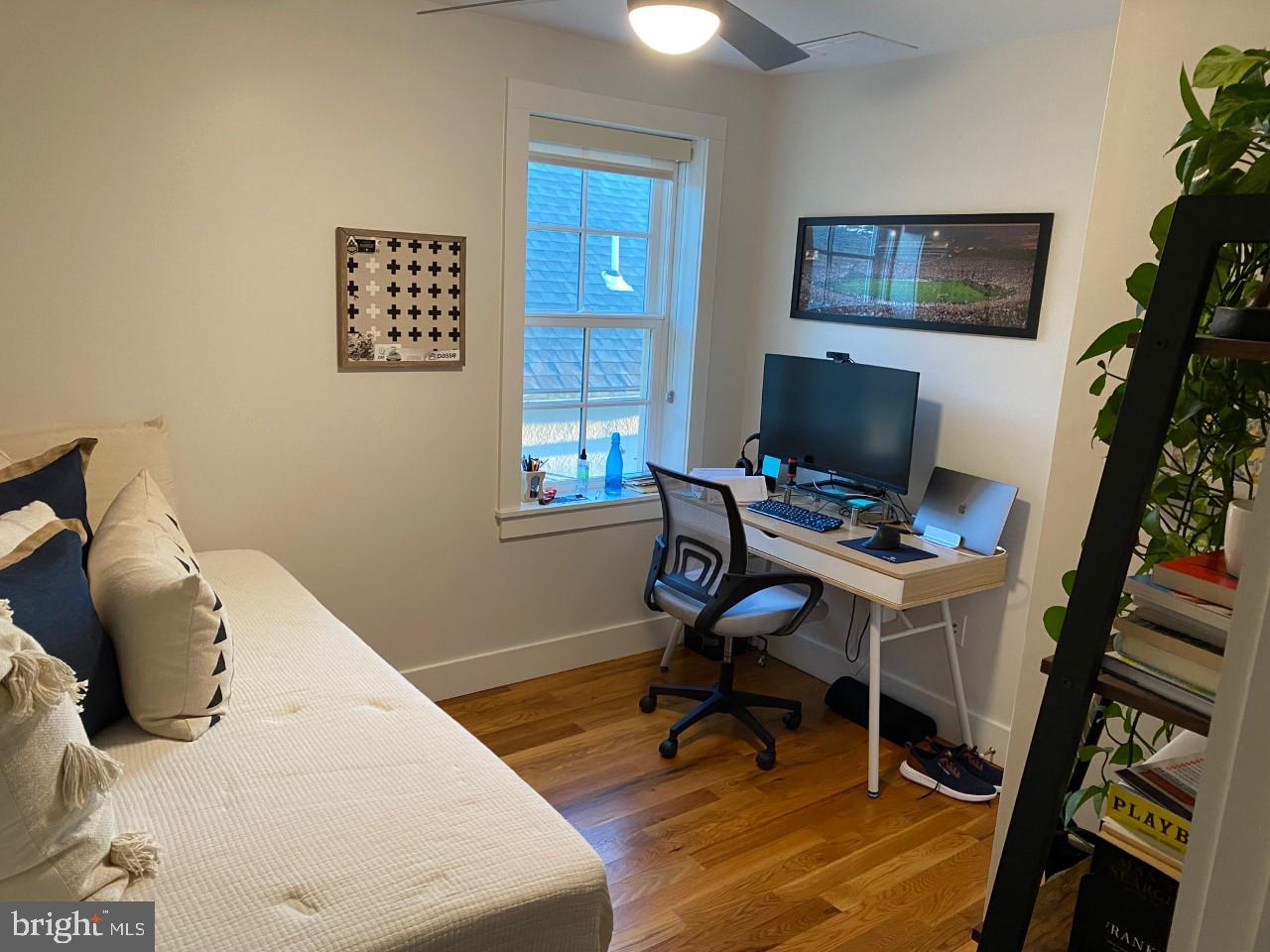 205 Witherspoon Street, Unit 4 Princeton, NJ 08542 - Photo 7 of 11 a view of a workspace with furniture and a potted plant