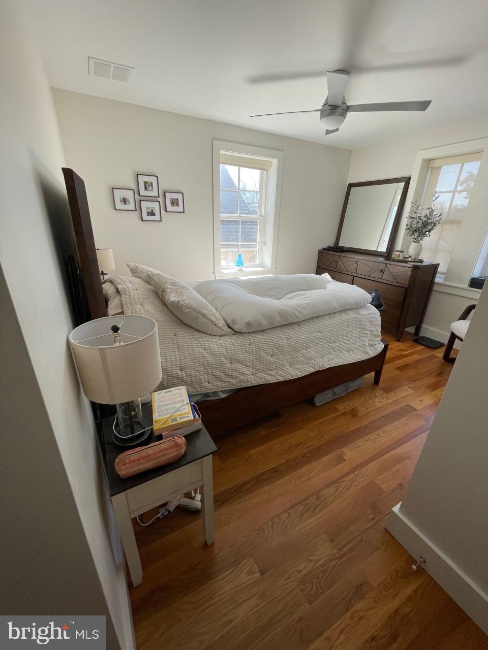 205 Witherspoon Street, Unit 4 Princeton, NJ 08542 - Photo 9 of 11 a bedroom with a bed and wooden floor