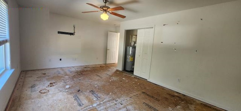 2402 Octopus Road Greenbackville, VA 23356 - Photo 14 of 21 an empty room with a ceiling fan and a window