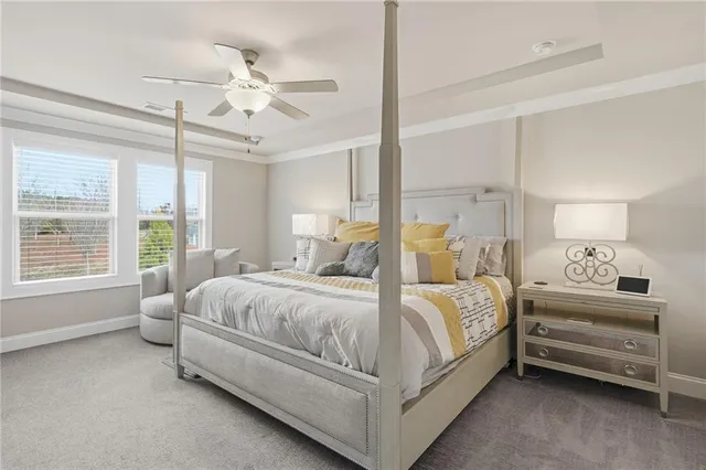 a bedroom with furniture and a flat screen tv