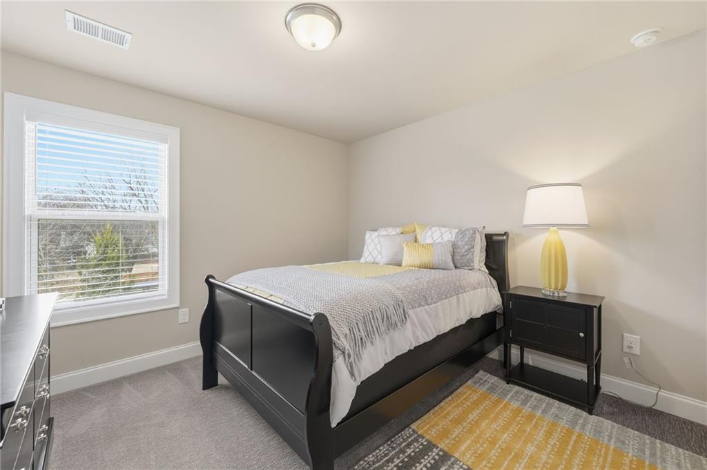 515 Cobblestone Circle Canton, GA 30115 - Photo 24 of 45 a bedroom with a bed and a window