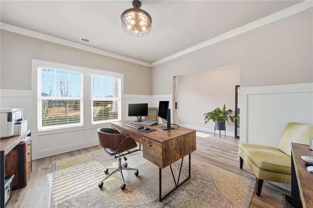515 Cobblestone Circle Canton, GA 30115 - Photo 27 of 45 a view of a workspace with furniture and a window