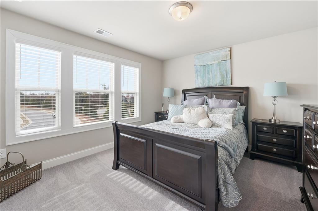 515 Cobblestone Circle Canton, GA 30115 - Photo 31 of 45 a bedroom with a bed and a window