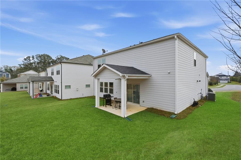 515 Cobblestone Circle Canton, GA 30115 - Photo 35 of 45 a view of a house with backyard