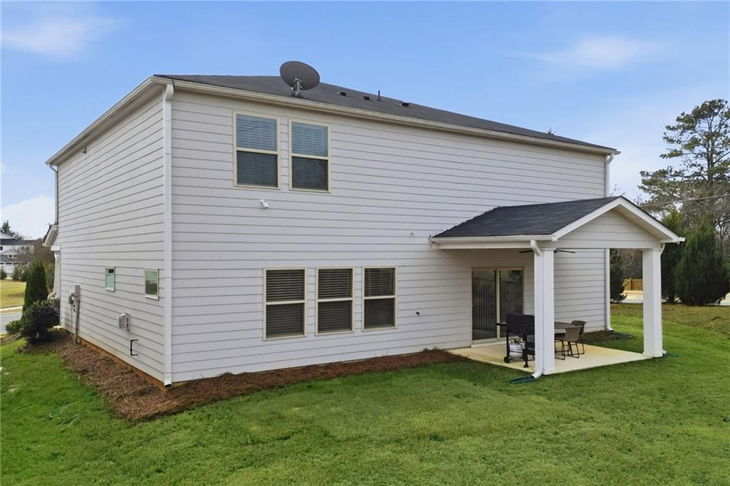 515 Cobblestone Circle Canton, GA 30115 - Photo 5 of 45 a front view of a house with a yard