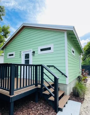 a backyard of a house with a deck