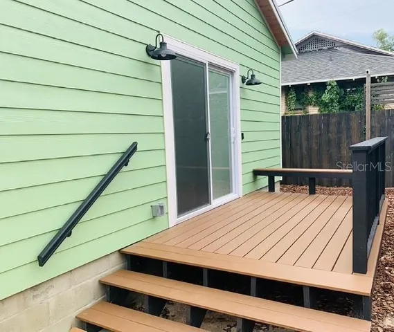 a balcony view with a seating space