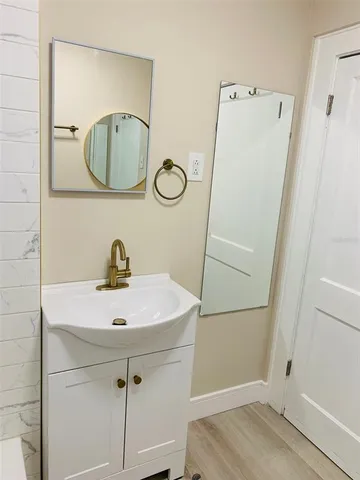 a bathroom with a sink and a mirror