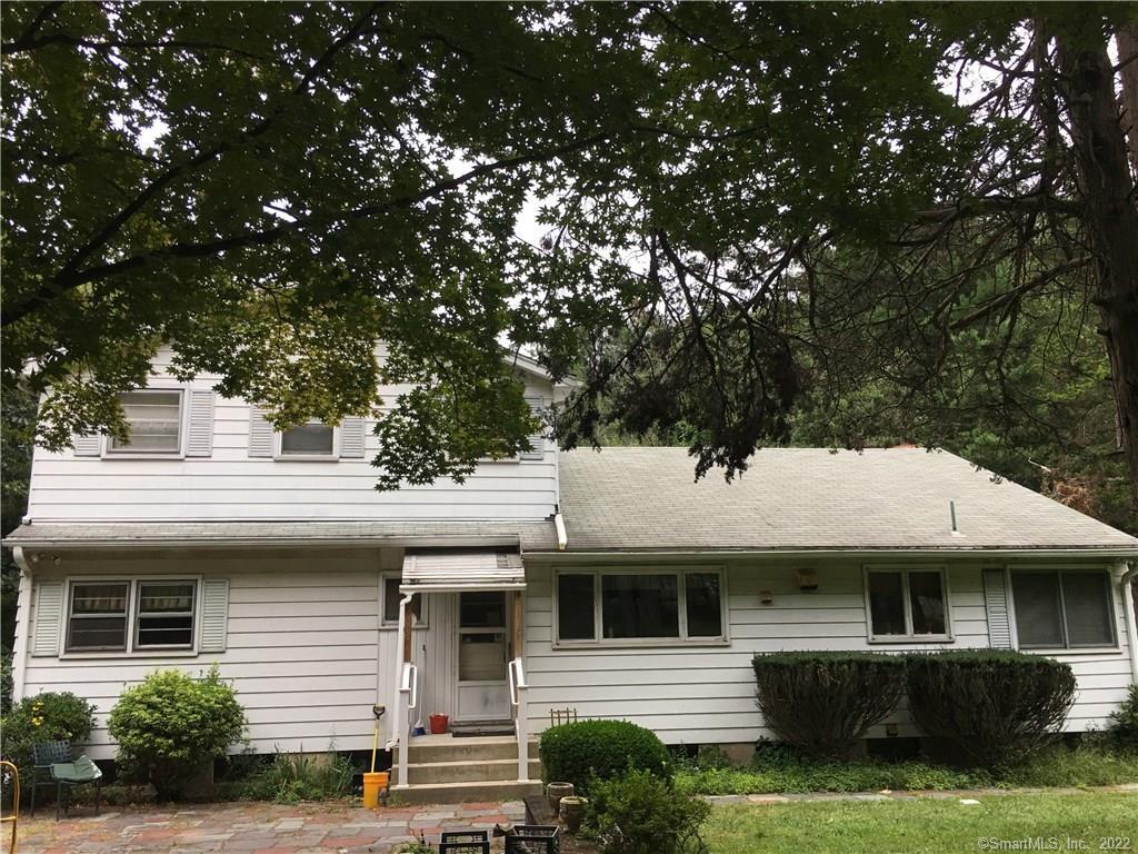 291 Cook Hill Road Cheshire, CT 06410 - Photo 1 of 1 a front view of a house with a garden