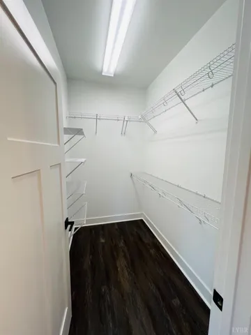 a view of storage and utility room with racks on the wall