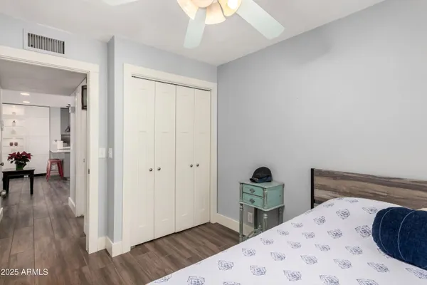 a bedroom with a bed and a table