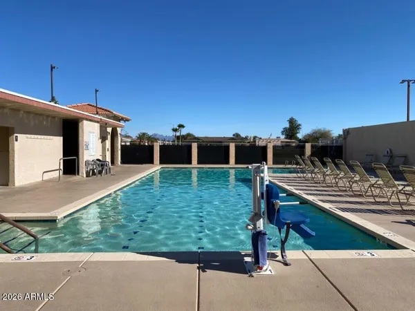 a view of a house with backyard porch and sitting area