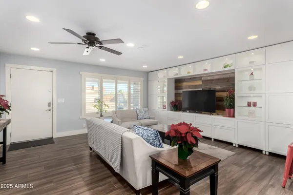 a living room with furniture and a flat screen tv