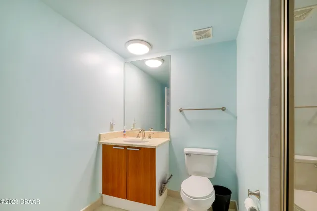 a bathroom with a toilet and a sink