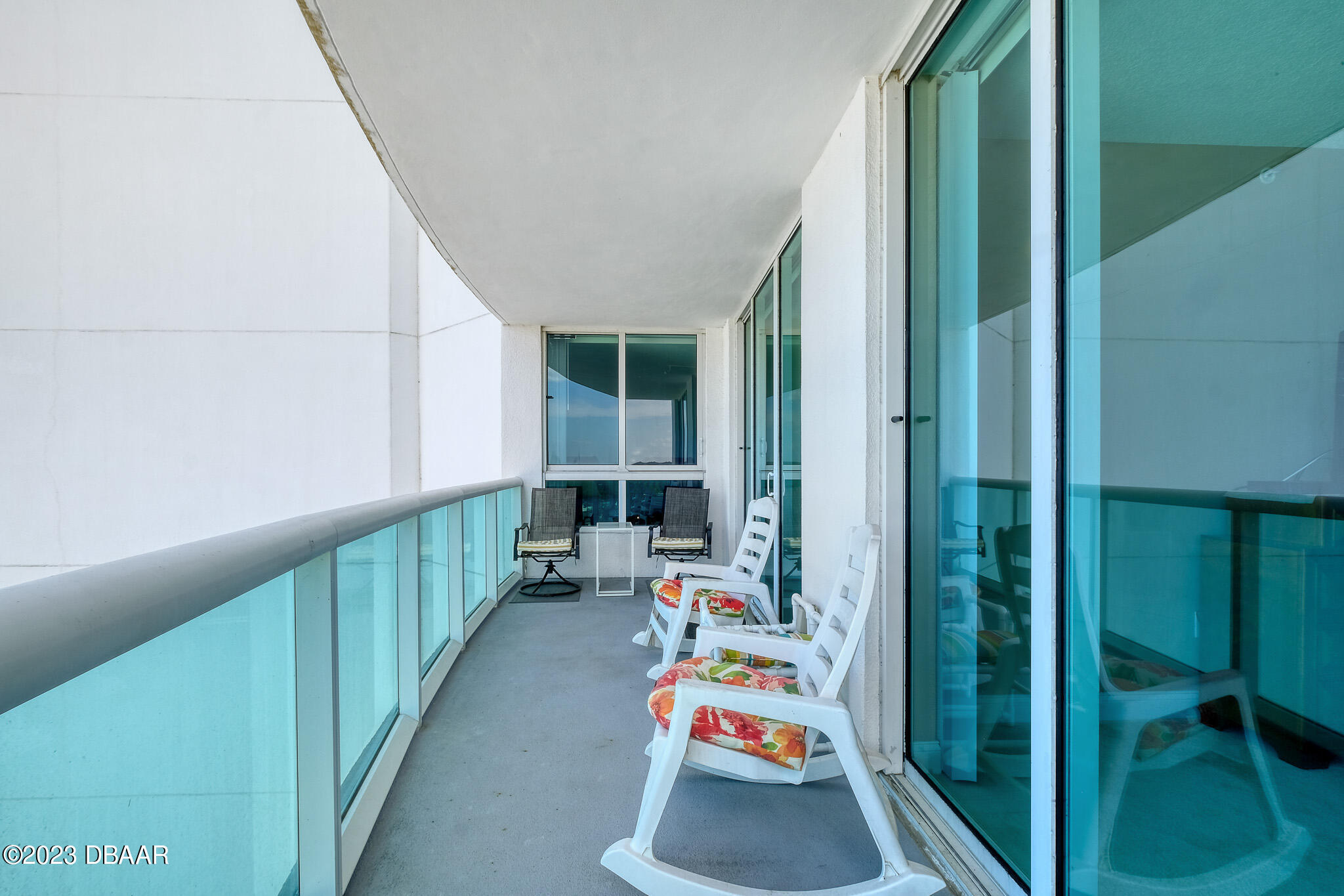 241 Riverside Drive, Unit 808 Holly Hill, FL 32117 - Photo 30 of 41 a bedroom with furniture and a large window