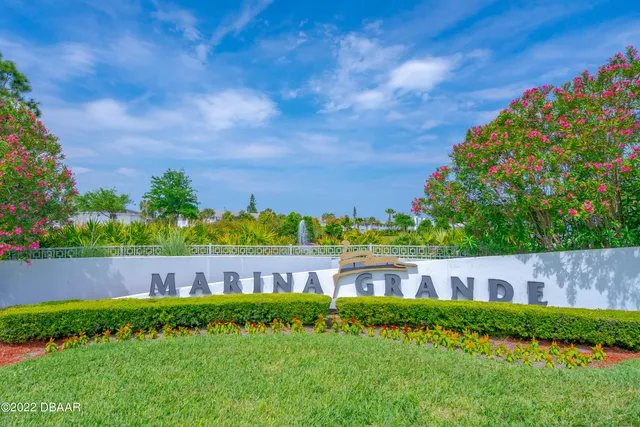 a view of a garden with a building in the background