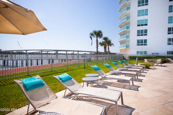 a view of swimming pool with chairs