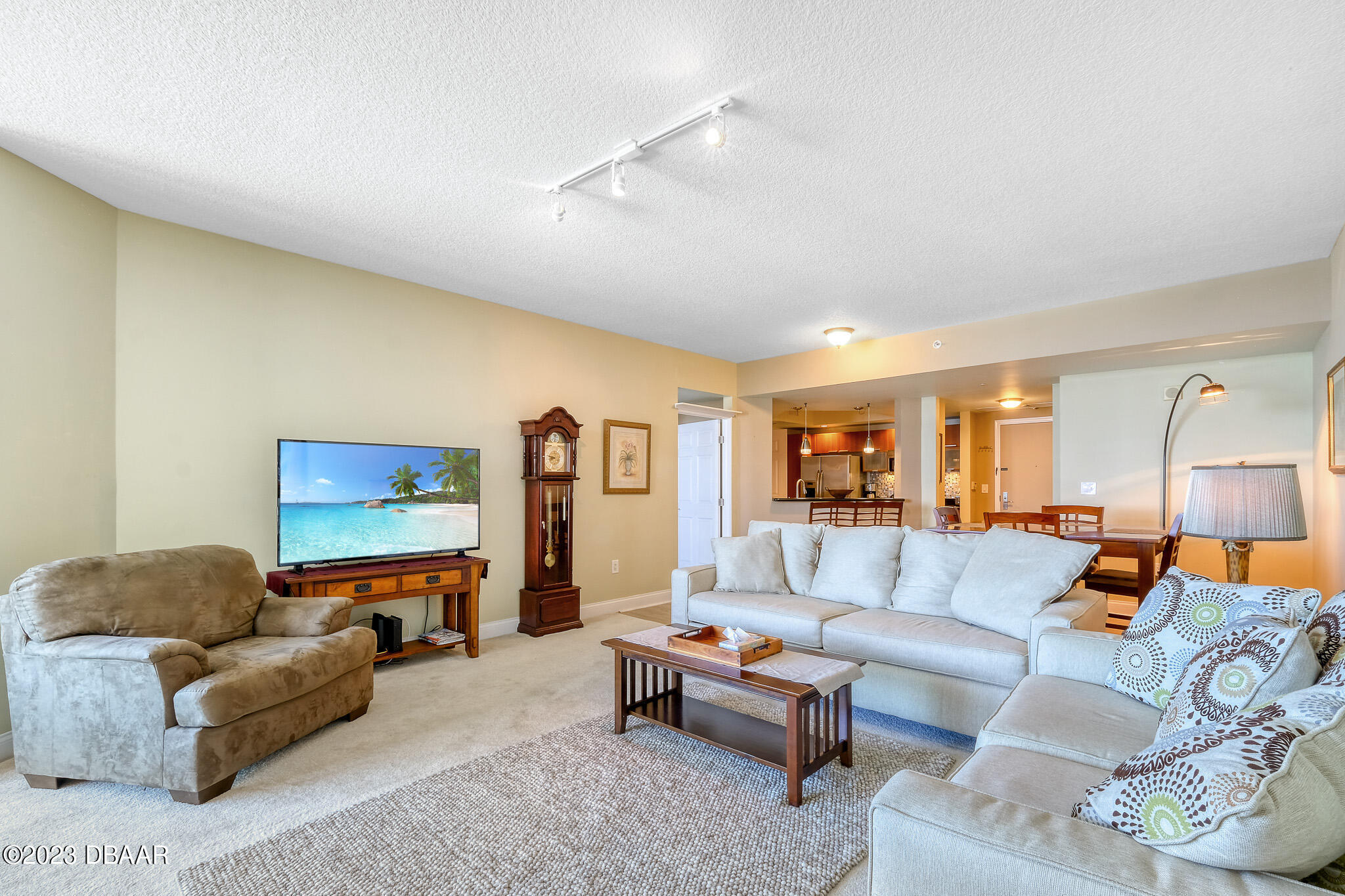 241 Riverside Drive, Unit 808 Holly Hill, FL 32117 - Photo 7 of 41 a living room with furniture and a flat screen tv