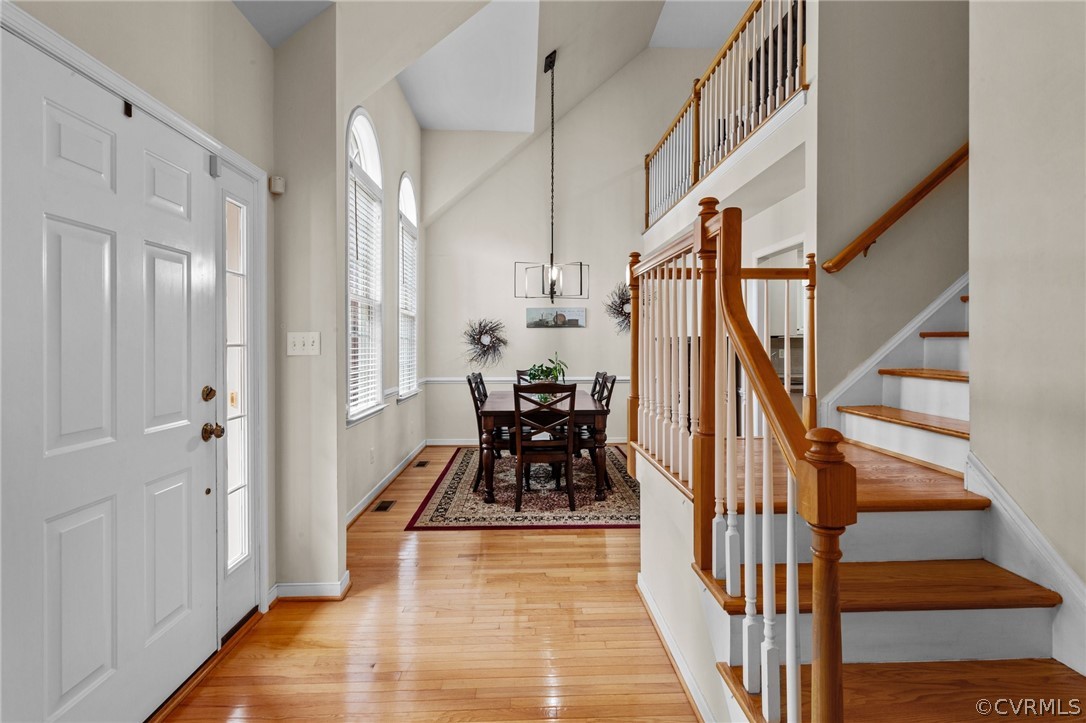 9437 Dunroming Road Chesterfield, VA 23832 - Photo 13 of 40 a view of a hallway with wooden floor and staircase