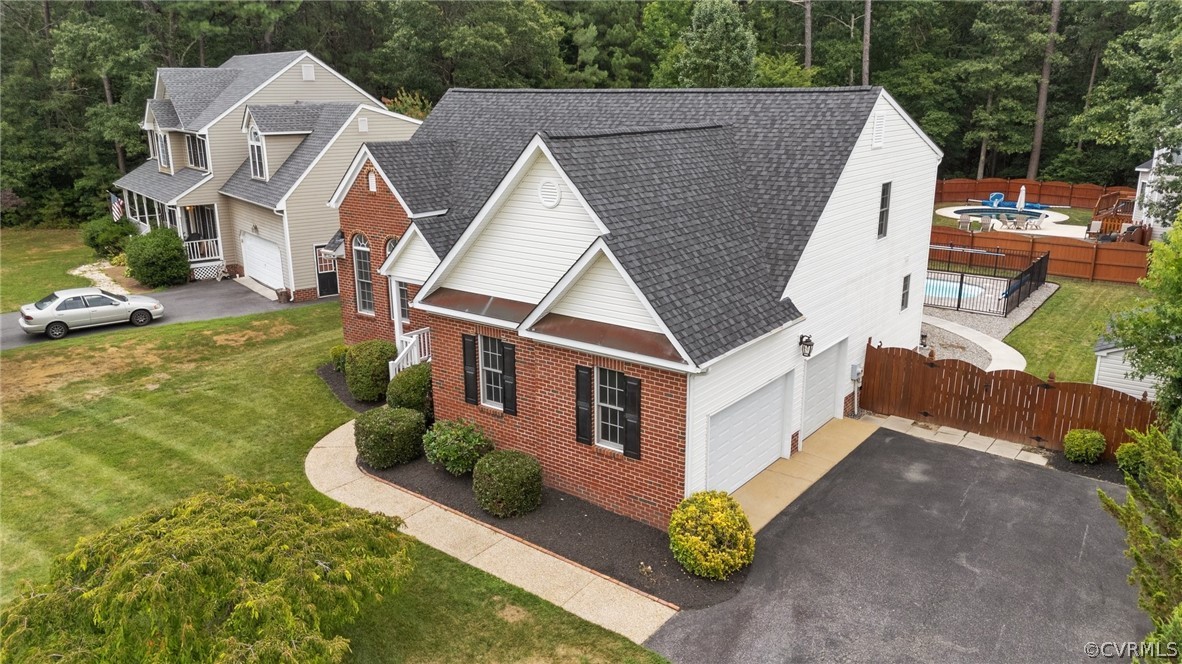 9437 Dunroming Road Chesterfield, VA 23832 - Photo 2 of 40 a aerial view of a house next to a yard