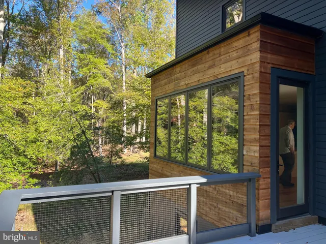 a view of a wooden door and an outdoor view