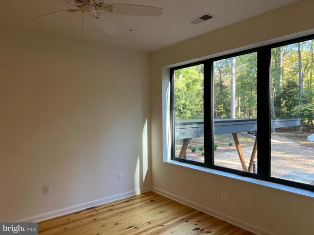 a view of a room with a large window