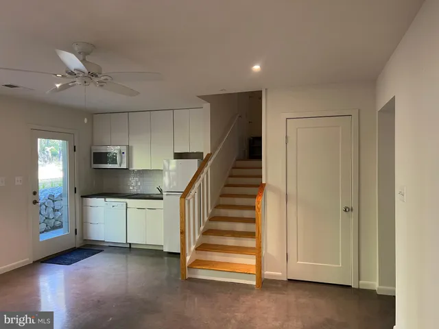 a view of entryway with cabinets