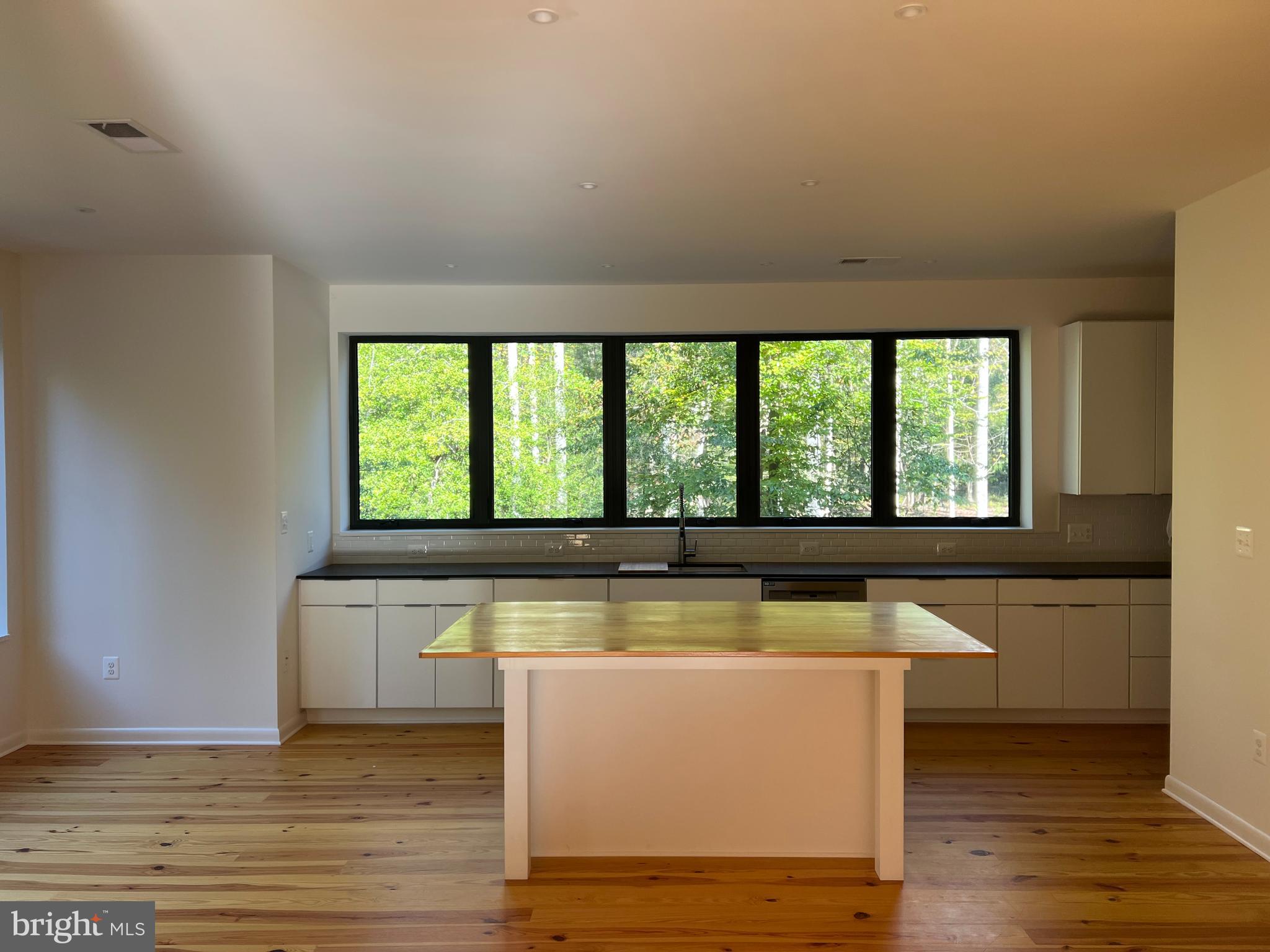 48 Waller Point Drive Stafford, VA 22554 - Photo 7 of 43 a view of a kitchen with wooden floor and a large window