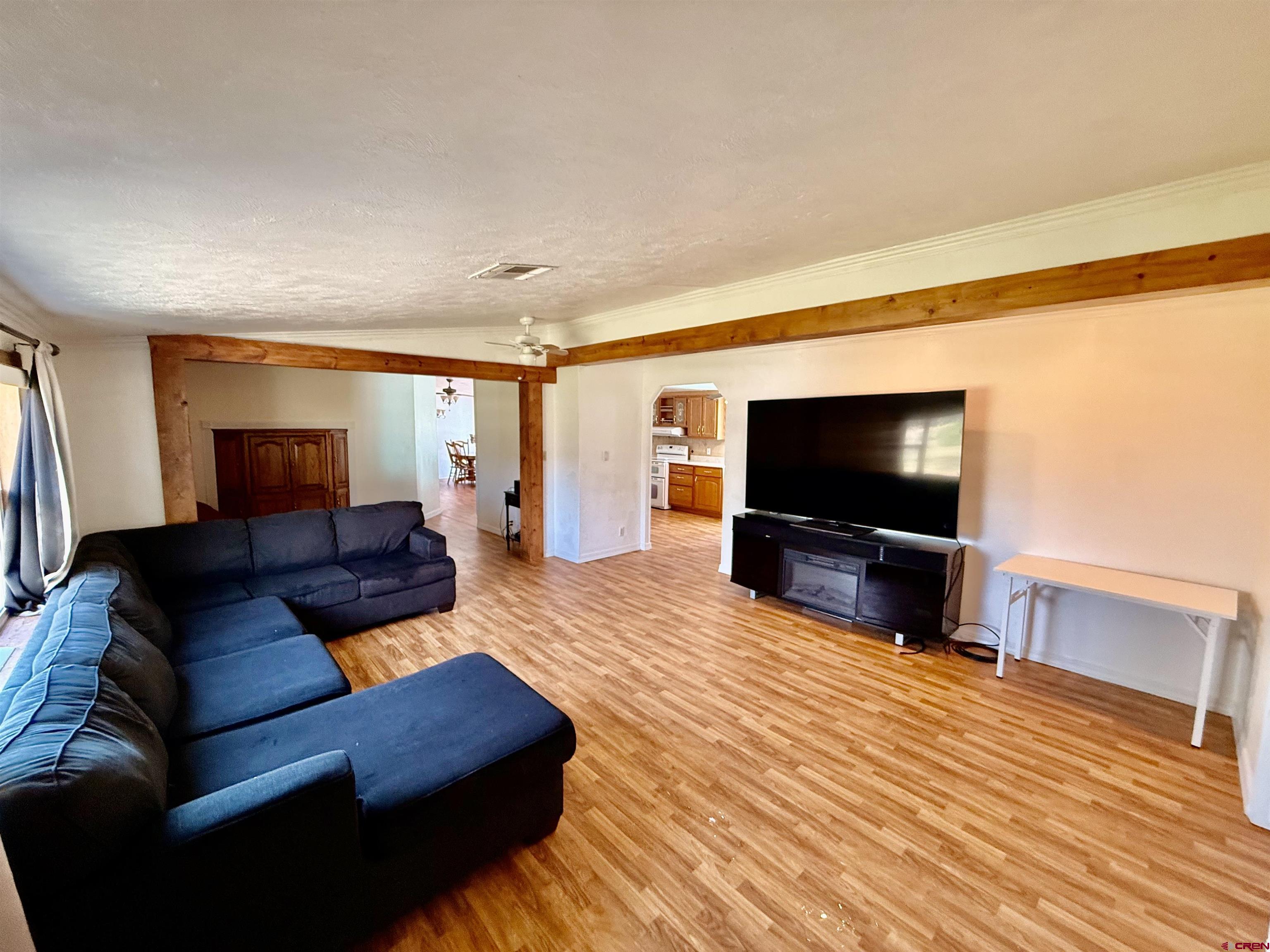 23825 Rd F.4 Cortez, CO 81321 - Photo 16 of 18 a living room with furniture and a flat screen tv