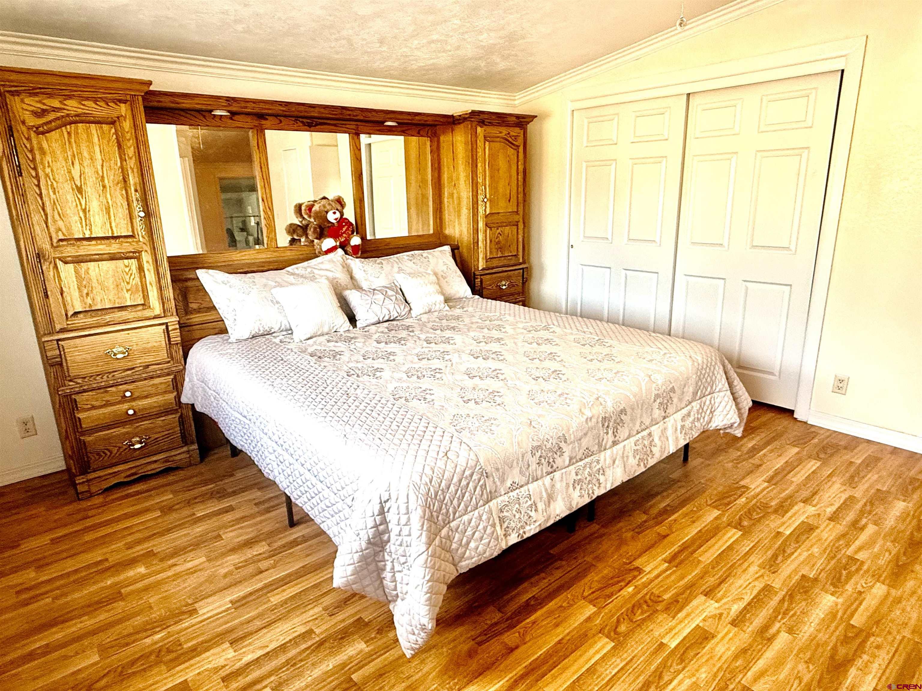 23825 Rd F.4 Cortez, CO 81321 - Photo 6 of 18 a bedroom with a bed and wooden floor